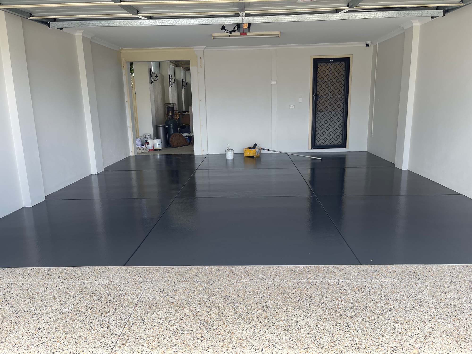 Freshly coated garage floor with a durable epoxy finish